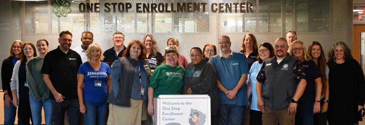 Admissions and financial aid staff standing in the One Stop Enrollment Center