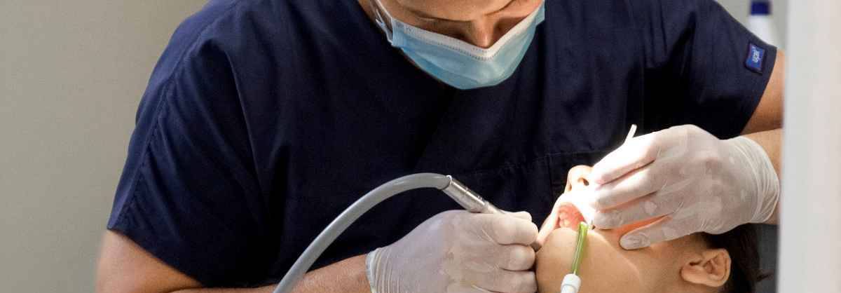 Dental hygientist working on a patient