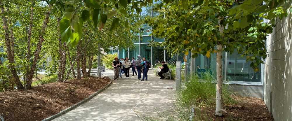 Berkshire Community College students and administration standing in front of a building