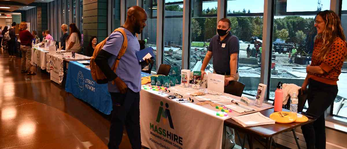 Students and staff offer resources at career fair.